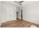 Bedroom featuring hardwood floors and ensuite bathroom at 6750 Pannell Rd, Buford, GA 30518