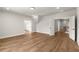 A light filled room offers hardwood floors and multiple entry doors at 6750 Pannell Rd, Buford, GA 30518