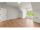 A brightly lit room offers hardwood floors, a bright window view, and a walk in closet at 6750 Pannell Rd, Buford, GA 30518