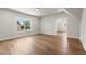 A light filled room offers hardwood floors, a bright window view, and walk in closet at 6750 Pannell Rd, Buford, GA 30518