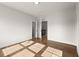 A bright room offers hardwood floors and two doorways with natural sunlight at 6750 Pannell Rd, Buford, GA 30518