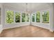 Breakfast nook features coffered ceilings and large windows offering lots of natural light at 6750 Pannell Rd, Buford, GA 30518