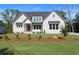 Inviting new construction home with freshly installed lawn and mulched beds at 6750 Pannell Rd, Buford, GA 30518