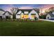Expansive front lawn of a modern home, showcasing meticulous landscaping and a well-maintained yard at 6750 Pannell Rd, Buford, GA 30518