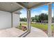 Inviting covered front porch with brick flooring and stately columns, perfect for relaxing outdoors at 6750 Pannell Rd, Buford, GA 30518