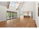 Open floor plan featuring a living room leading to a kitchen with access to a screened in patio at 6750 Pannell Rd, Buford, GA 30518