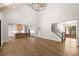Open-concept living room and kitchen with high ceilings, wood floors and large windows at 6750 Pannell Rd, Buford, GA 30518