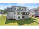 View of new home from rear, showing covered porch and ample lawn space at 6750 Pannell Rd, Buford, GA 30518