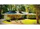 Charming single-story home with stone accents, mature trees, and a well-manicured lawn at 1516 Chase Ct, Riverdale, GA 30296