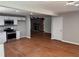 Open concept kitchen with stainless steel appliances and a fireplace view at 1516 Chase Ct, Riverdale, GA 30296