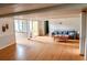Inviting living room with light hardwood floors, coffered ceilings, and great natural light at 1516 Chase Ct, Riverdale, GA 30296