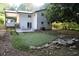 Backyard features a putting green, patio, landscaped stones, with a covered porch area at 3199 Nw Delmar Ln, Atlanta, GA 30311