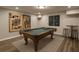 Finished basement is staged as a rec room, features pool table, bar, and cool art at 3199 Nw Delmar Ln, Atlanta, GA 30311