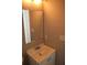Bathroom vanity features white cabinet, faucet, mirror, and overhead lighting at 3199 Nw Delmar Ln, Atlanta, GA 30311
