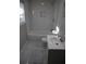 Updated bathroom features white subway tile in shower, tiled floors, new vanity and window at 3199 Nw Delmar Ln, Atlanta, GA 30311