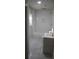 Bright bathroom features a shower with subway tile and a modern vanity with a sink at 3199 Nw Delmar Ln, Atlanta, GA 30311