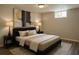 Comfortable bedroom showcasing an elegant bed, stylish decor, and wood-look floors with bright, natural light at 3199 Nw Delmar Ln, Atlanta, GA 30311