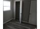 Bedroom with wood-look flooring, closet, and window with natural light at 3199 Nw Delmar Ln, Atlanta, GA 30311