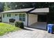 This angle highlights the carport, a covered parking structure, which offers protection from the elements at 3199 Nw Delmar Ln, Atlanta, GA 30311