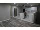 This kitchen has an island with an electric cooktop and the subway tile matches the countertops for a modern look at 3199 Nw Delmar Ln, Atlanta, GA 30311