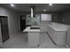 Beautifully renovated kitchen features white cabinets, quartz countertops, and stainless steel appliances at 3199 Nw Delmar Ln, Atlanta, GA 30311