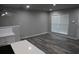 Open-concept space with sleek flooring, bright modern white paint, and abundant natural light at 3199 Nw Delmar Ln, Atlanta, GA 30311
