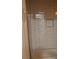 Close up shot of tiled shower with built in niche, white subway tile, and tub at 3199 Nw Delmar Ln, Atlanta, GA 30311