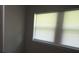 Window features blinds in a gray wall at 3199 Nw Delmar Ln, Atlanta, GA 30311