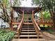 Inviting covered back deck featuring outdoor seating and charming decorative details at 4114 Falcon Shores Nw Ct, Acworth, GA 30101