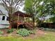 Back deck with wood railings and decorative lighting leads to stairs down to yard at 4114 Falcon Shores Nw Ct, Acworth, GA 30101
