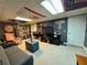 Finished basement with fun decor, gray carpet, a media center, and cozy seating at 4114 Falcon Shores Nw Ct, Acworth, GA 30101