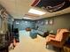Finished basement features a cozy seating area, entertainment center, and sports-themed decor at 4114 Falcon Shores Nw Ct, Acworth, GA 30101