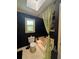 Bathroom with skylight, bathtub and leafy decor at 4114 Falcon Shores Nw Ct, Acworth, GA 30101