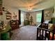Sweet bedroom with two sunny windows, gray carpet, and unique tree decor at 4114 Falcon Shores Nw Ct, Acworth, GA 30101