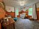 Bright Bedroom design features a warm color scheme, a crib, and a cozy sitting area at 4114 Falcon Shores Nw Ct, Acworth, GA 30101