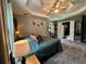 Spacious bedroom with a tray ceiling, walk-in closet, and access to the en-suite bathroom at 4114 Falcon Shores Nw Ct, Acworth, GA 30101