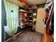 Cozy walk-in closet features custom corner shelves and natural light from the window at 4114 Falcon Shores Nw Ct, Acworth, GA 30101