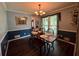 Dining room featuring a wood table, bench, and decorative chandelier at 4114 Falcon Shores Nw Ct, Acworth, GA 30101