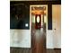 Inviting entryway featuring hardwood floors and stylish decor, leading to a well-lit foyer at 4114 Falcon Shores Nw Ct, Acworth, GA 30101