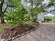 Two-story home with attached garage, beautiful landscaping and inviting driveway at 4114 Falcon Shores Nw Ct, Acworth, GA 30101
