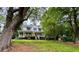 Charming two-story home with a large front porch and mature trees, situated on a well-manicured lawn at 4114 Falcon Shores Nw Ct, Acworth, GA 30101
