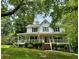 Inviting two-story home with a spacious front porch, offering a warm and welcoming curb appeal at 4114 Falcon Shores Nw Ct, Acworth, GA 30101