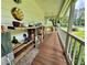 Inviting front porch with shelves and seating, ideal for relaxing and enjoying the scenery at 4114 Falcon Shores Nw Ct, Acworth, GA 30101