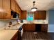 Traditional kitchen featuring wood cabinets, bright countertops, and stainless steel appliances at 4114 Falcon Shores Nw Ct, Acworth, GA 30101