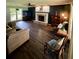 Cozy living room with wood floors, brick fireplace, and ample natural light at 4114 Falcon Shores Nw Ct, Acworth, GA 30101