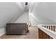 Bright attic space with dormer windows, neutral paint, and built-in storage, offering flexible living or storage options at 654 Cannon Rd, Sharpsburg, GA 30277
