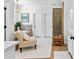 Bathroom includes a soaking tub, walk-in shower, neutral tile, and a vanity with a white countertop at 654 Cannon Rd, Sharpsburg, GA 30277