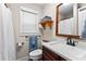 Clean bathroom with a wood-framed mirror, providing a functional and well-lit space at 654 Cannon Rd, Sharpsburg, GA 30277