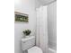 Cozy bathroom featuring a floral-print shower curtain and a white subway tile at 654 Cannon Rd, Sharpsburg, GA 30277