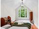 Bright bedroom with large window, pitched roof, and reading nook at 654 Cannon Rd, Sharpsburg, GA 30277